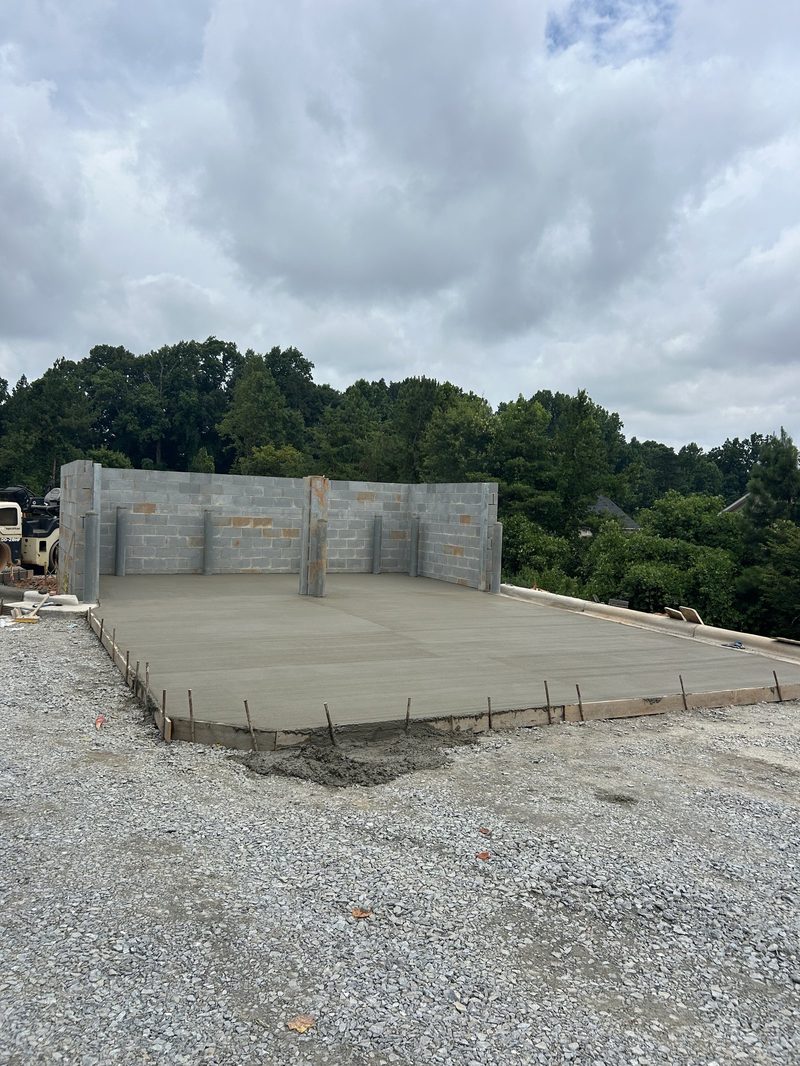 Freshly poured concrete pad foundation with block walls in Spartanburg SC
