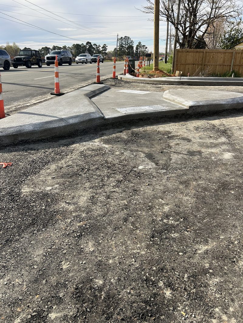 Newly installed concrete curb and gutter alongside roadway in Gastonia NC